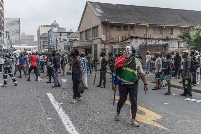 Anti-illegal immigration protestors chant slogans against foreign nationals during a march in Durban on October 9, 2026