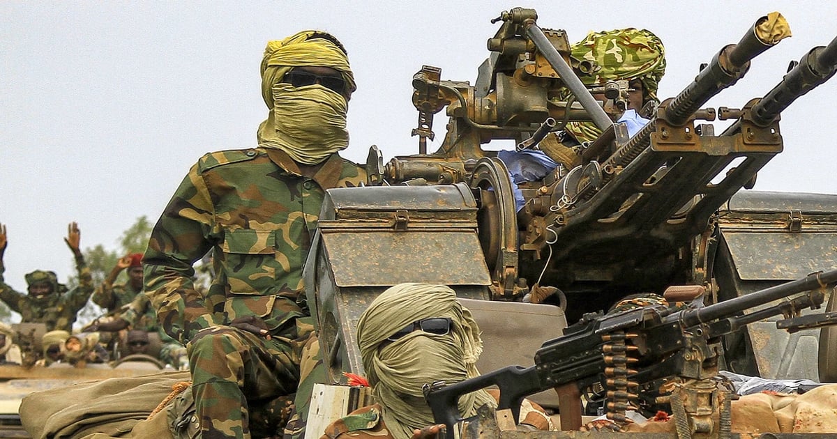 Fighters ride in a military convoy accompanying the governor of Darfur in Gedaref, Sudan